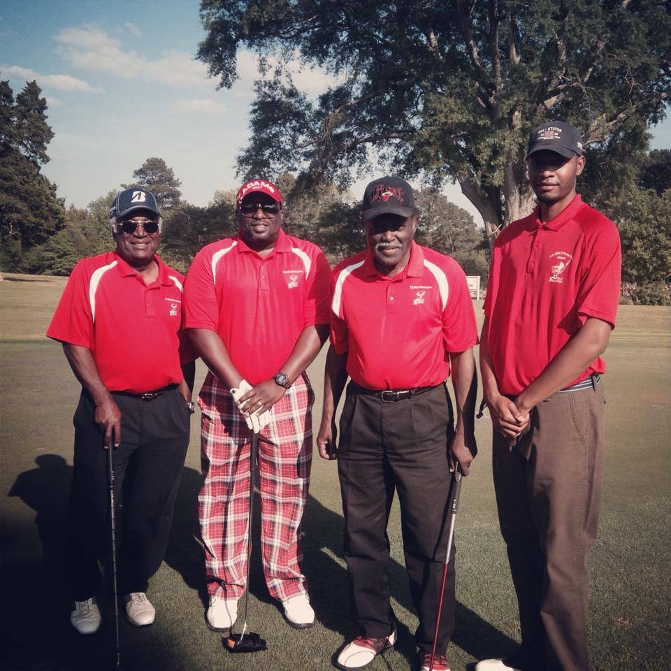 Brothers on the golf course in red polo shirts