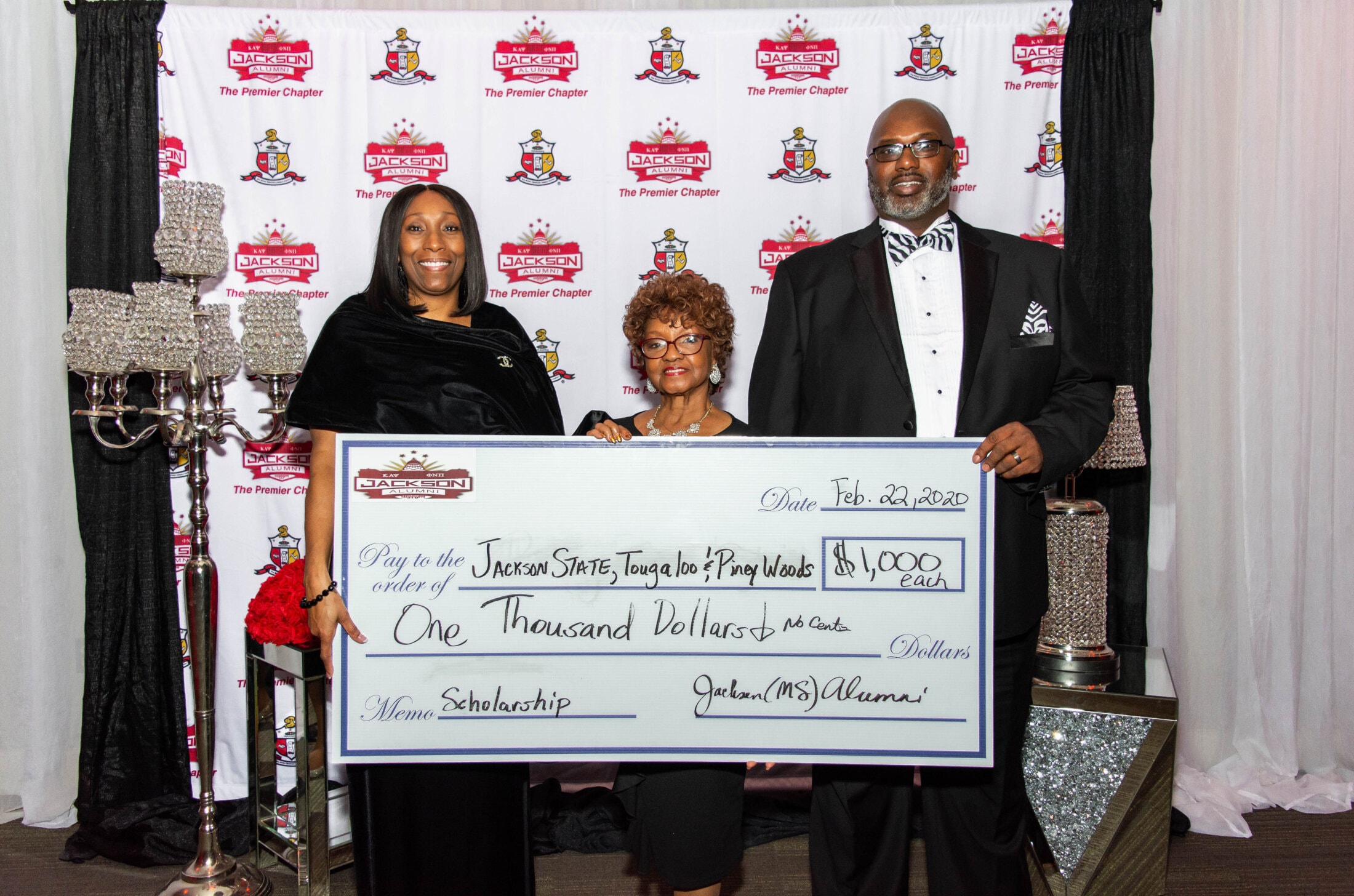 Brothers presenting scholarship check to Jackson State, Tougaloo, and Piney Woods