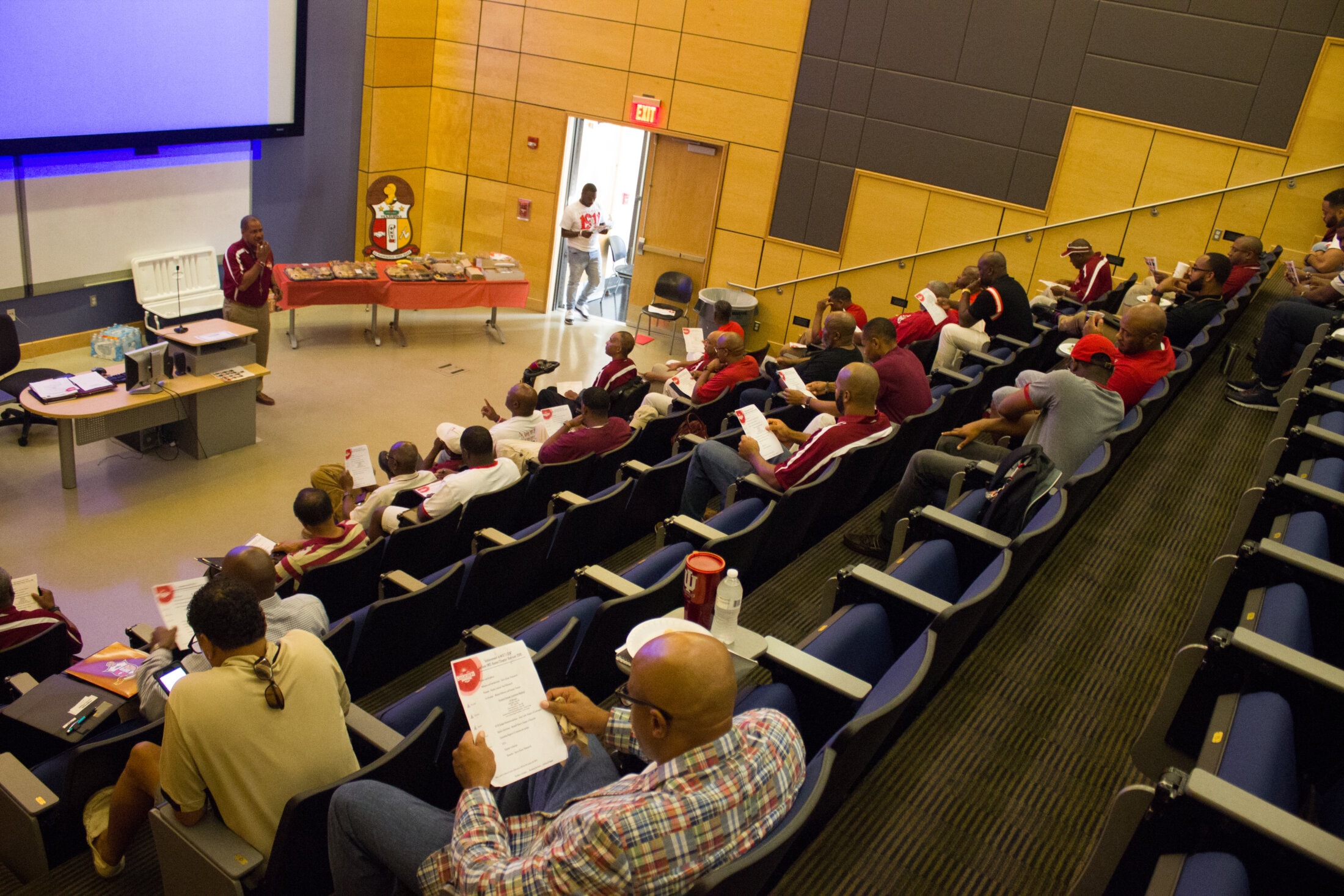 Brothers seated in auditorium at JSU CSET Building for chapter meeting