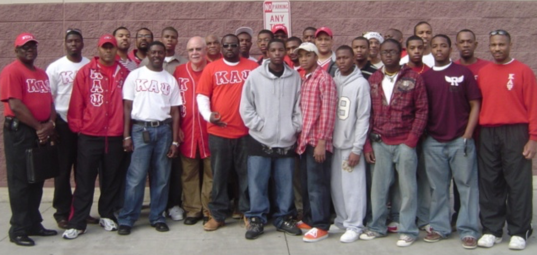 Brothers with Kappa League youth members in group photo outside