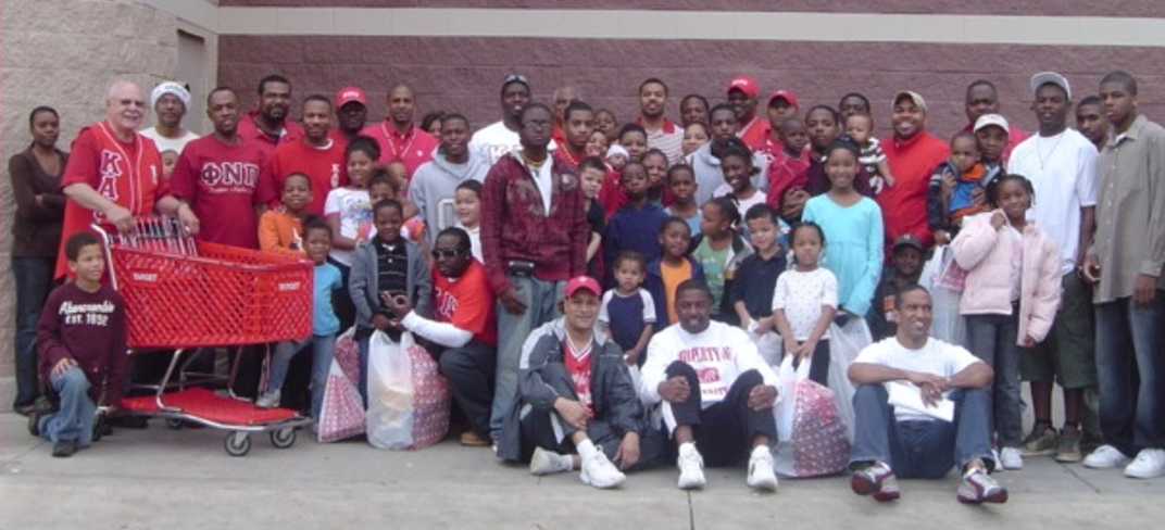 Brothers and community members at Target holiday toy and gift drive
